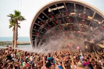Image of crowd with arms in air in front of Papaya stage at Hideout Festival