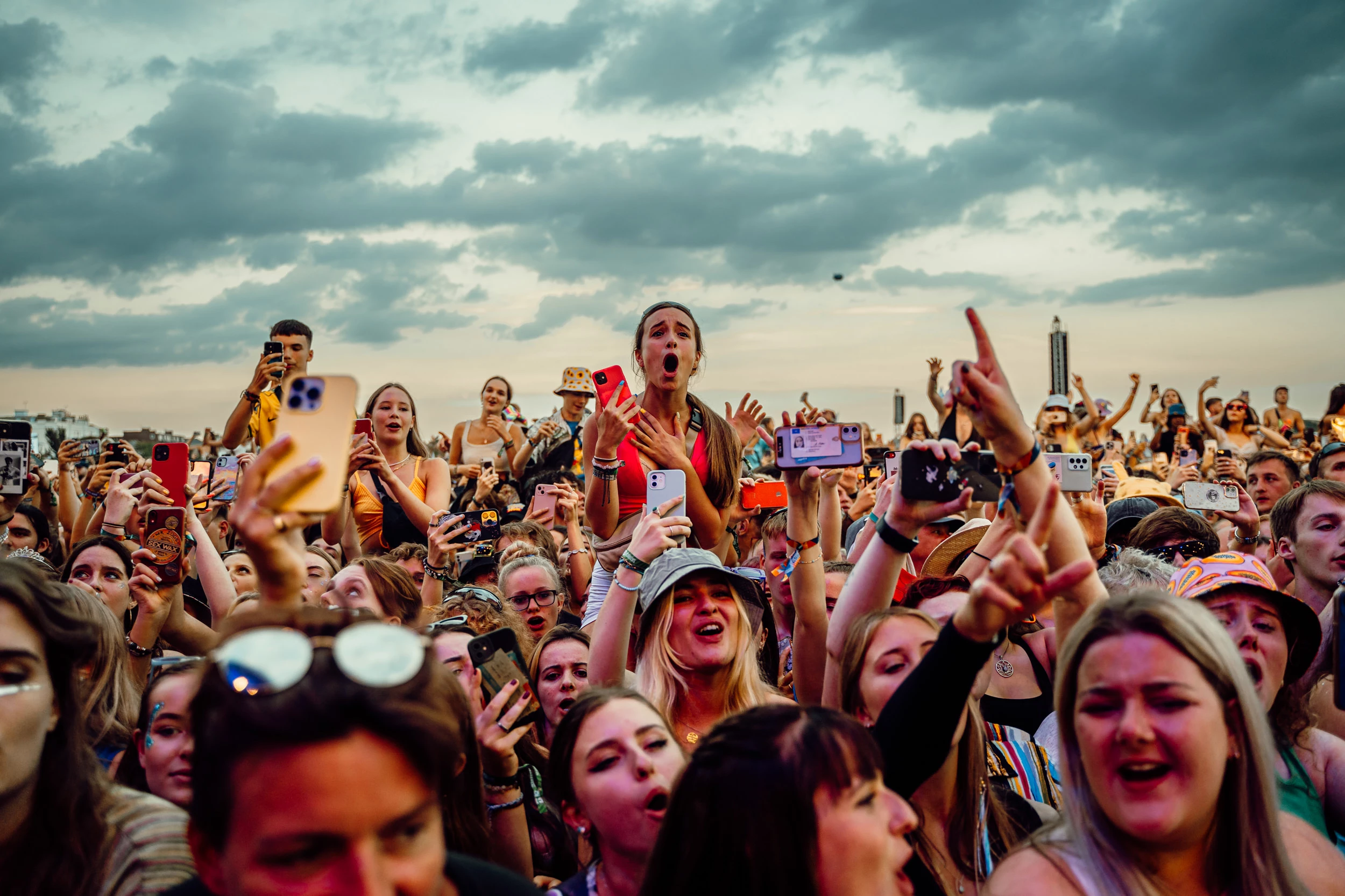 Image of girl on friend's shoulders watching a performance at Victorious Festival