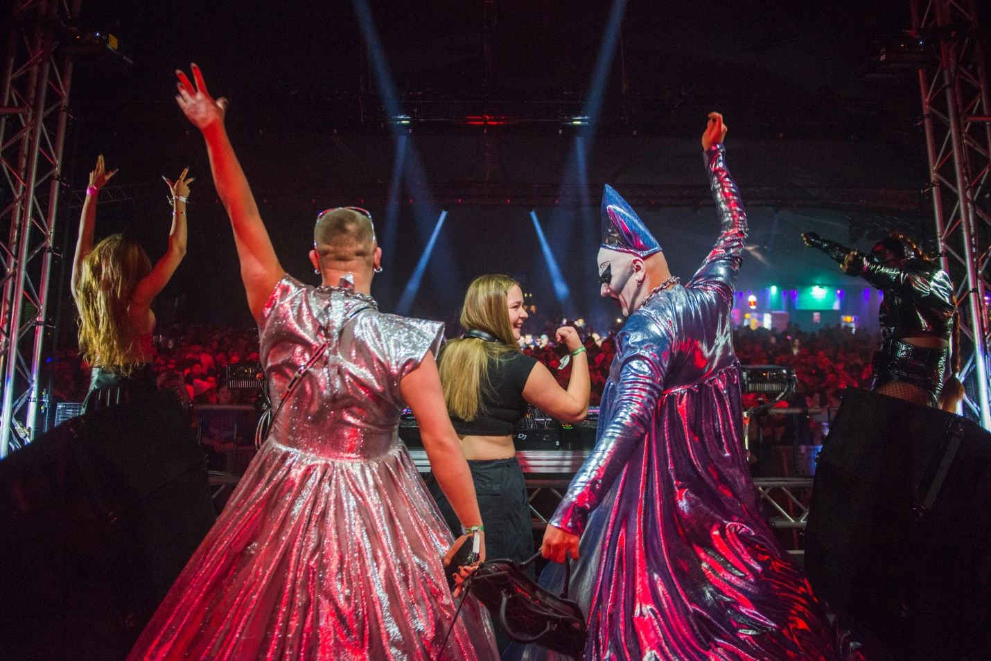 DJs and drag performers dancing on stage