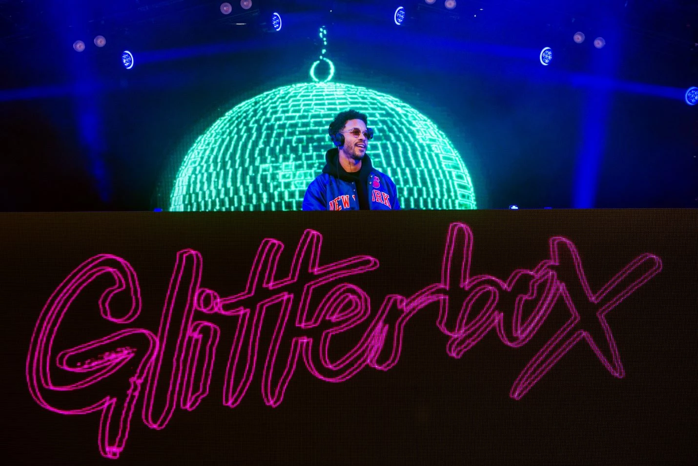 A DJ performing on stage at Snowbombing