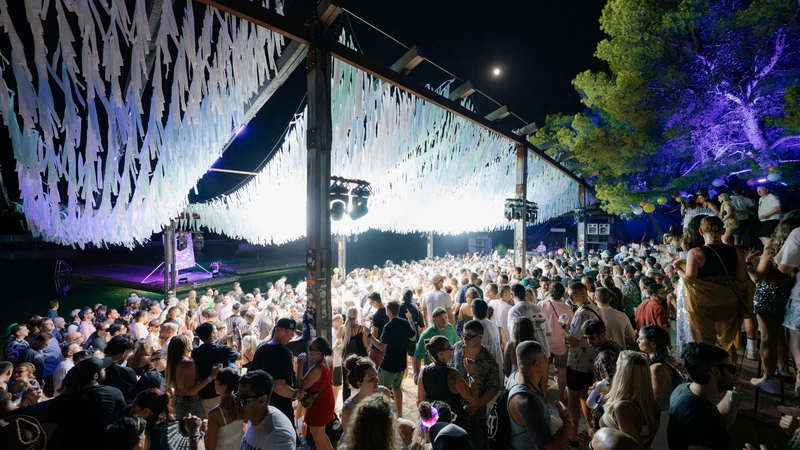 A packed crowd dancing in the moonlight at Balance Croatia's boutique Beach Stage